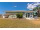 Cozy backyard patio with comfortable seating, ideal for enjoying peaceful moments outdoors at 8152 Seashell St, Englewood, FL 34224