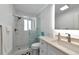 Contemporary bathroom showcasing a glass-enclosed shower, modern fixtures, and a stylish vanity with quartz countertop at 8152 Seashell St, Englewood, FL 34224