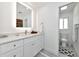 Modern bathroom showcasing a vanity, mirror and adjacent toilet room for added privacy at 8152 Seashell St, Englewood, FL 34224
