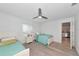 Comfortable bedroom featuring a ceiling fan and neutral décor at 8152 Seashell St, Englewood, FL 34224