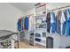 Organized walk-in closet with ample storage, shelving, and hanging space for clothing and accessories at 8152 Seashell St, Englewood, FL 34224