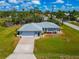 Charming single-story home with a well-manicured lawn, a long driveway and lovely curb appeal at 8152 Seashell St, Englewood, FL 34224