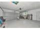 Spacious garage includes overhead door, storage shelves and convenient side access door at 8152 Seashell St, Englewood, FL 34224