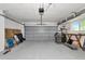Spacious garage with overhead door, storage and room for projects at 8152 Seashell St, Englewood, FL 34224