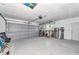 Spacious garage includes overhead door and storage for all your needs at 8152 Seashell St, Englewood, FL 34224