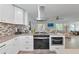 Well-equipped kitchen featuring stainless steel appliances, modern cabinetry, and an open layout at 8152 Seashell St, Englewood, FL 34224