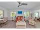 Bright living room featuring modern furniture, a ceiling fan, and recessed lighting at 8152 Seashell St, Englewood, FL 34224