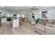 Open concept living space with modern kitchen, dining area, and a comfortable living room setup at 8152 Seashell St, Englewood, FL 34224