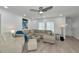 Bright living room featuring modern furniture, a ceiling fan, and recessed lighting at 8152 Seashell St, Englewood, FL 34224