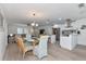 Open floor plan showcasing a dining area, a modern kitchen and a comfortable living space at 8152 Seashell St, Englewood, FL 34224