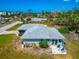 Lovely single-story home with a private patio, lush greenery, and a serene, tranquil backyard at 8152 Seashell St, Englewood, FL 34224