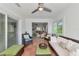 Relaxing sunroom with wicker furniture, terracotta tile and views of the neighborhood at 8152 Seashell St, Englewood, FL 34224