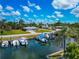 Scenic waterfront property featuring lush vegetation, boat docks, and waterfront homes at 8152 Seashell St, Englewood, FL 34224