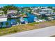 Waterfront homes with boats docked in canals, offering direct access to the water at 8152 Seashell St, Englewood, FL 34224