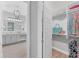 Bright bathroom with light gray cabinets, double sink, and stylish closet at 8258 Grande Shores Dr, Sarasota, FL 34240