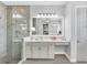 Contemporary bathroom featuring a glass-enclosed shower and white vanity at 8258 Grande Shores Dr, Sarasota, FL 34240