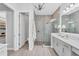 Stylish bathroom with a glass shower, modern vanity, and large closet at 8258 Grande Shores Dr, Sarasota, FL 34240