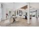 Open floor plan living and dining room with lots of light, hardwood floors, and modern design at 8258 Grande Shores Dr, Sarasota, FL 34240