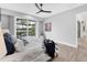 Modern main bedroom featuring a pool view and white interior at 8258 Grande Shores Dr, Sarasota, FL 34240