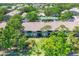 Aerial view of condo community with mature trees and meticulously maintained landscaping at 8921 Veranda Way # 325, Sarasota, FL 34238