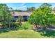 Beautifully maintained condo complex with lush landscaping and manicured lawns creating a serene outdoor environment at 8921 Veranda Way # 325, Sarasota, FL 34238