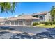 Exterior showcases multiple garages with manicured landscaping and traditional architectural details at 8921 Veranda Way # 325, Sarasota, FL 34238