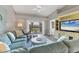 Inviting living room with a plush sofa and a view to the outdoor patio overlooking a golf course at 8921 Veranda Way # 325, Sarasota, FL 34238