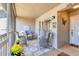 The cozy patio showcases seating, a decorative butterfly, and a 'hello' welcome mat at 8921 Veranda Way # 325, Sarasota, FL 34238