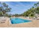 Community pool with inviting blue water and plenty of seating for residents at 8921 Veranda Way # 325, Sarasota, FL 34238