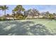 Outdoor tennis court with lush landscaping surrounding at 8921 Veranda Way # 325, Sarasota, FL 34238