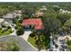 Aerial view of luxury single Gathering home featuring mature trees, lush landscaping, and a paver driveway at 901 Reflection Way, Osprey, FL 34229