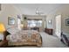 Spacious bedroom featuring soft lighting, ceiling fan, and outdoor views at 901 Reflection Way, Osprey, FL 34229