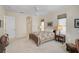Neutral bedroom with ceiling fan, two windows, and soft lighting at 901 Reflection Way, Osprey, FL 34229