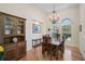 Elegant dining room featuring wood floors, chandelier lighting, and decorative touches with plenty of space at 901 Reflection Way, Osprey, FL 34229
