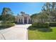 Beautiful home featuring a paver driveway, lush landscaping, and an elegant front entry at 901 Reflection Way, Osprey, FL 34229