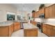 Spacious kitchen features granite counters, stainless appliances, tile backsplash and flooring at 901 Reflection Way, Osprey, FL 34229