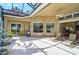 Inviting screened patio with water feature, lounge chairs, and ample space for outdoor entertaining at 901 Reflection Way, Osprey, FL 34229