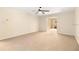 Large bedroom features neutral carpet and ceiling fan at 919 80Th Nw St, Bradenton, FL 34209