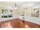 Bright dining room features hardwood floors, large windows, and modern lighting at 919 80Th Nw St, Bradenton, FL 34209
