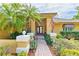 Charming home exterior with lush landscaping, a brick walkway and a welcoming entrance at 919 80Th Nw St, Bradenton, FL 34209