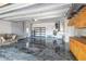 Spacious garage with epoxy flooring, storage cabinets, and a work area at 919 80Th Nw St, Bradenton, FL 34209