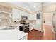 Well-equipped kitchen features stainless appliances, mosaic backsplash, and white cabinetry at 919 80Th Nw St, Bradenton, FL 34209