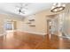 Spacious living room with hardwood floors, open layout, ceiling fan and natural light at 919 80Th Nw St, Bradenton, FL 34209