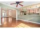 Open-concept living space featuring hardwood floors, columns, and a bar area for seamless entertaining at 919 80Th Nw St, Bradenton, FL 34209