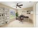 Comfortable home office with modern built-in shelving and a large window, ideal for a productive workspace at 919 80Th Nw St, Bradenton, FL 34209