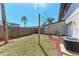 This backyard features a tropical landscape and privacy fence at 1026 Longfellow Ct # 111, Sarasota, FL 34243