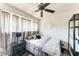 Cozy bedroom with dark wood floors, natural light, and black metal shelving at 1026 Longfellow Ct # 111, Sarasota, FL 34243