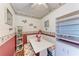 Eat-in kitchen dining nook features bench seating, wood flooring, and decorative plate display at 1026 Longfellow Ct # 111, Sarasota, FL 34243