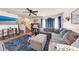 Cozy living room with plush seating, decorative accents, and a ceiling fan for added comfort at 1026 Longfellow Ct # 111, Sarasota, FL 34243