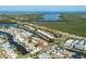 Aerial view of a waterfront community with canal access to the bay and single Gathering homes at 10304 Sandpiper W Rd, Bradenton, FL 34209